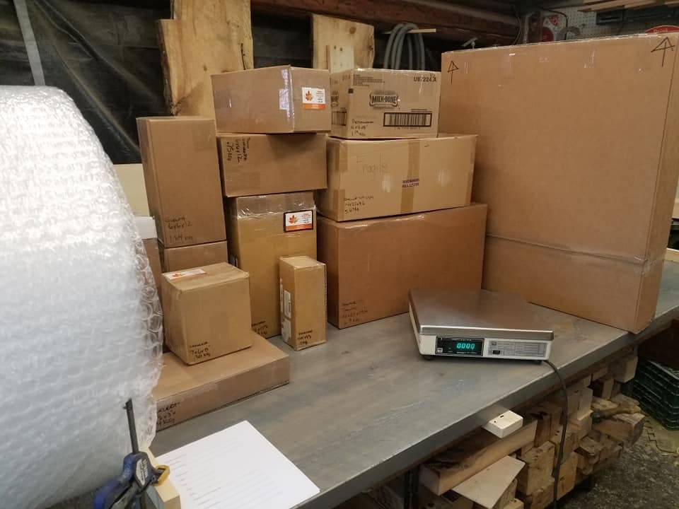Packed parcels on a scale, ready to ship from a Gillanders sale